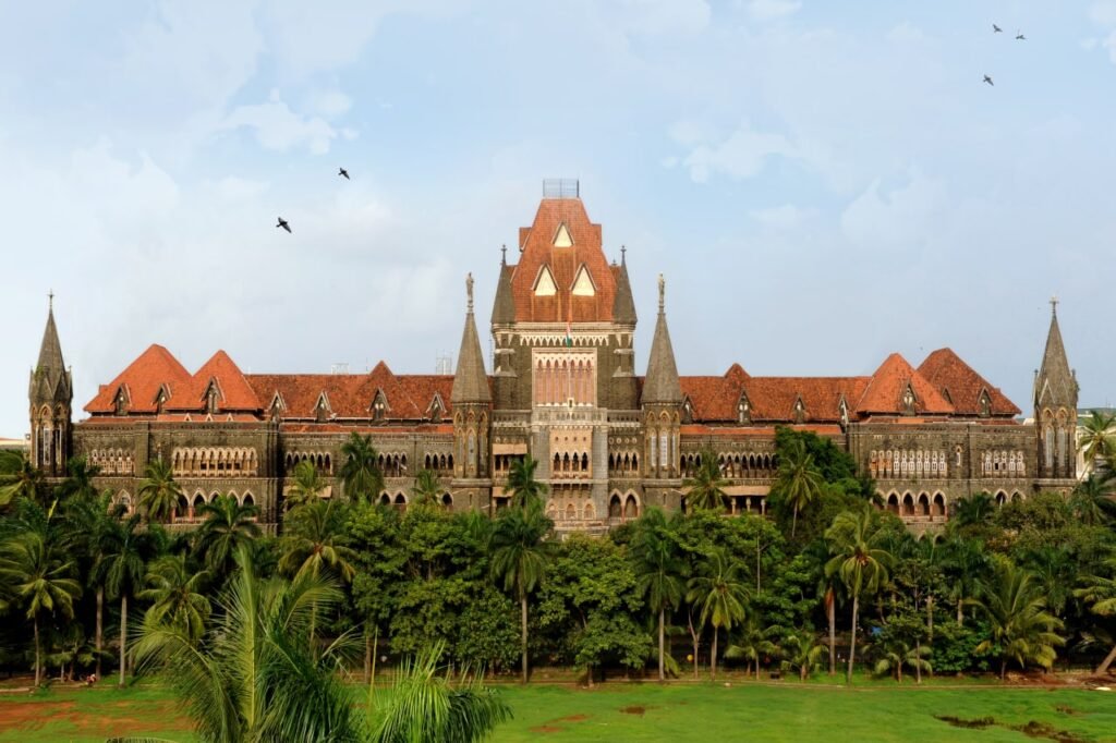 Signing succession certificate documents for a Mumbai court filing, with gavel and legal papers on a desk