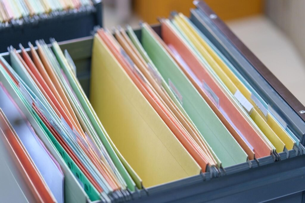 Organized paperwork and files representing documents required for legal and administrative processes